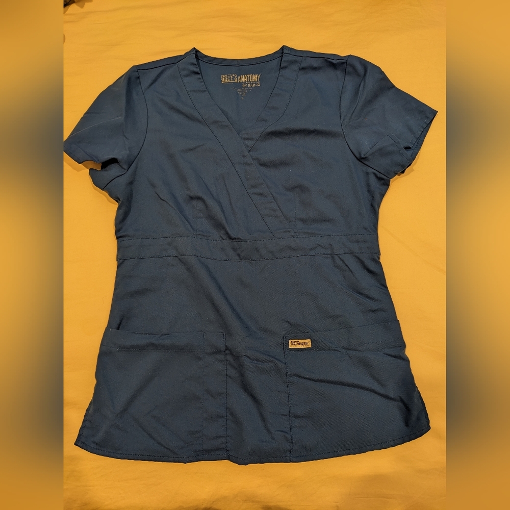 3 Scrub sets plus two scrub tops